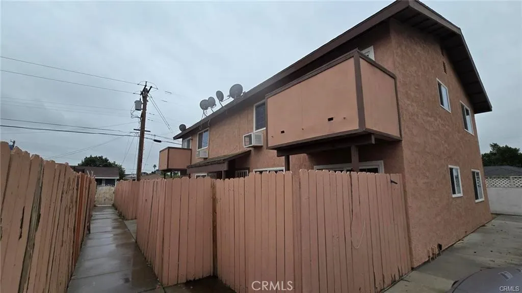 308 North Millard Avenue Rialto, CA 92376 - Photo 7 of 11 a view of a house with wooden fence