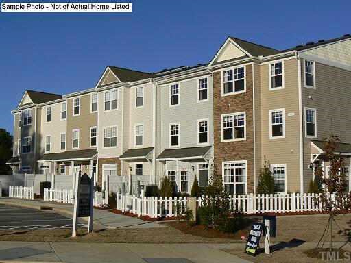a front view of a building with a street view