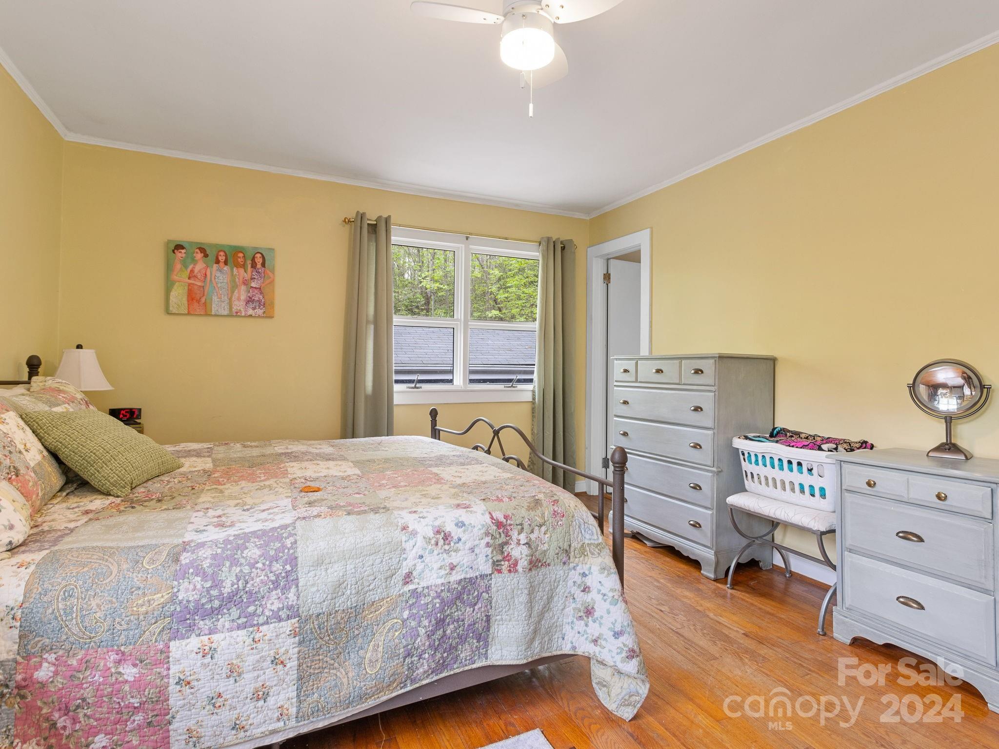159 Jervey Road Tryon, NC 28782 - Photo 16 of 43 a bedroom with a bed and a dresser