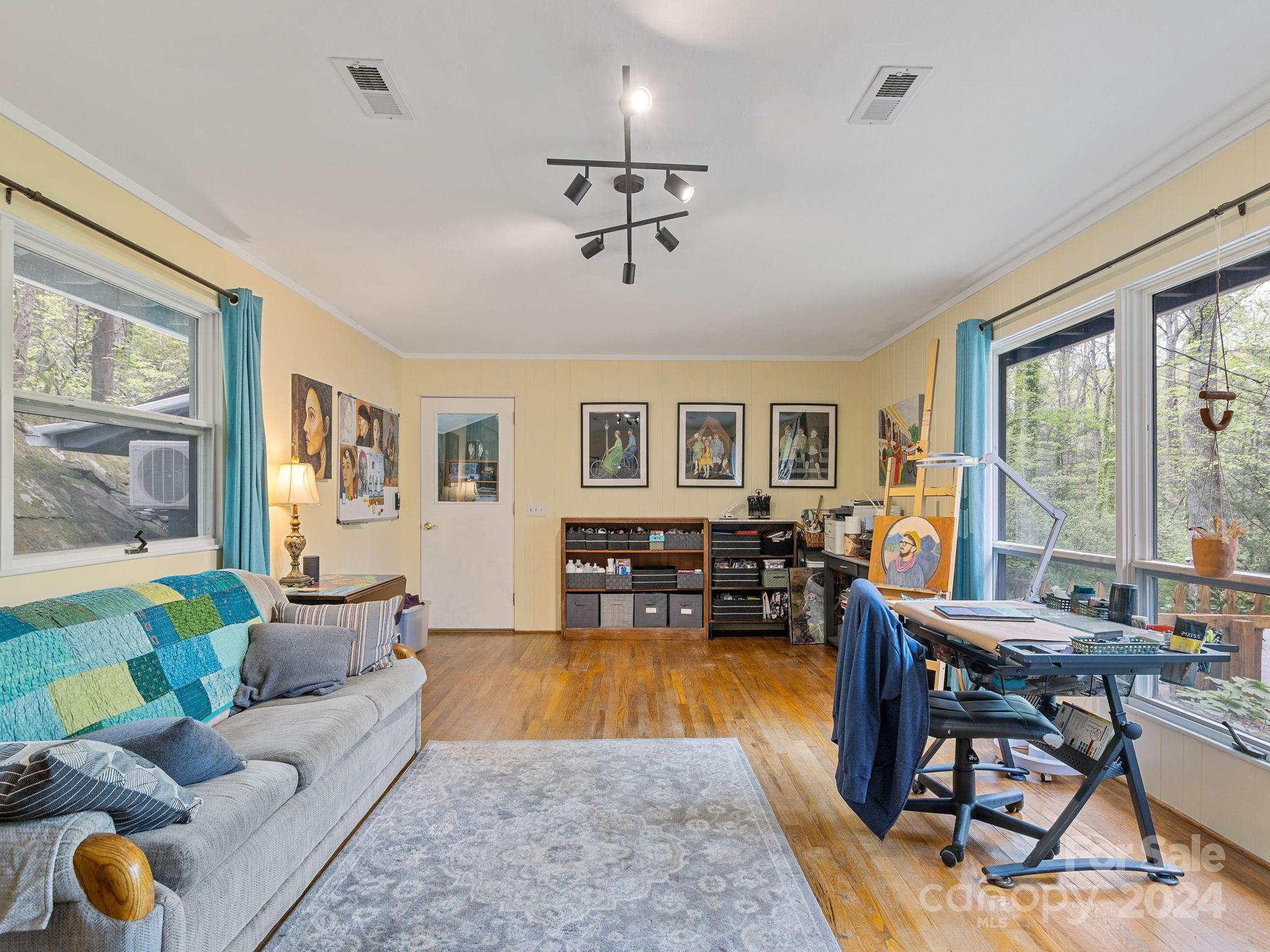 159 Jervey Road Tryon, NC 28782 - Photo 26 of 43 a living room with furniture fireplace and a large window