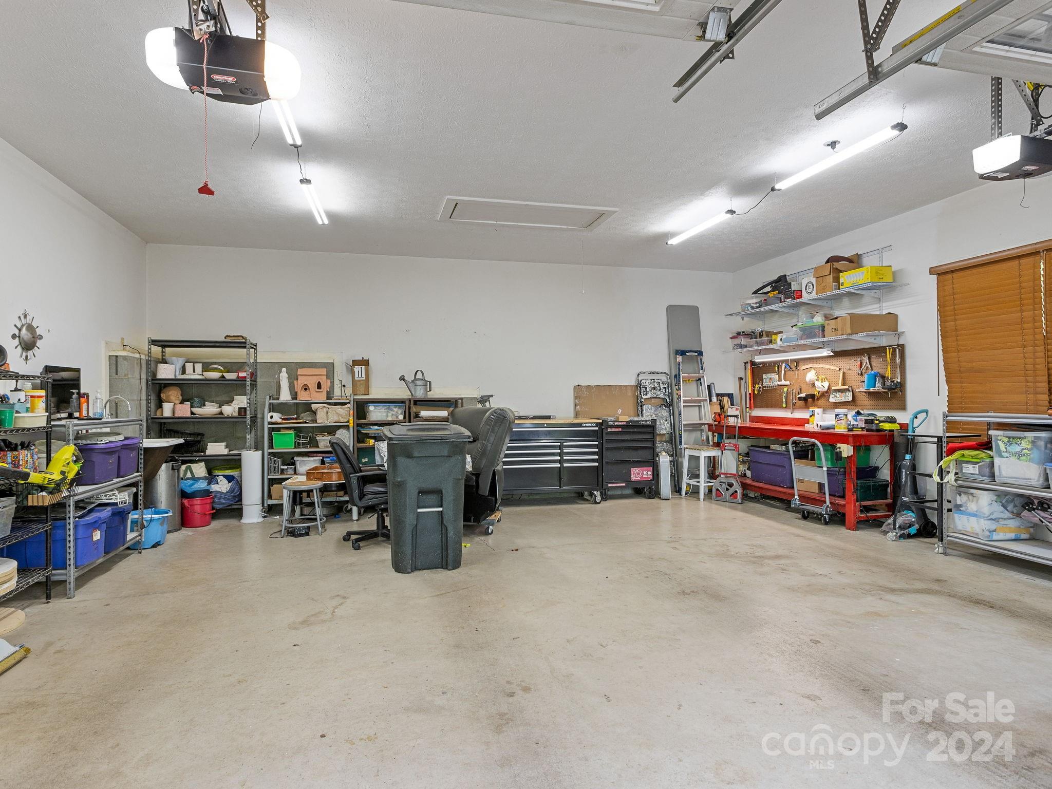 159 Jervey Road Tryon, NC 28782 - Photo 31 of 43 a view of a storage in a room with furniture and a garage