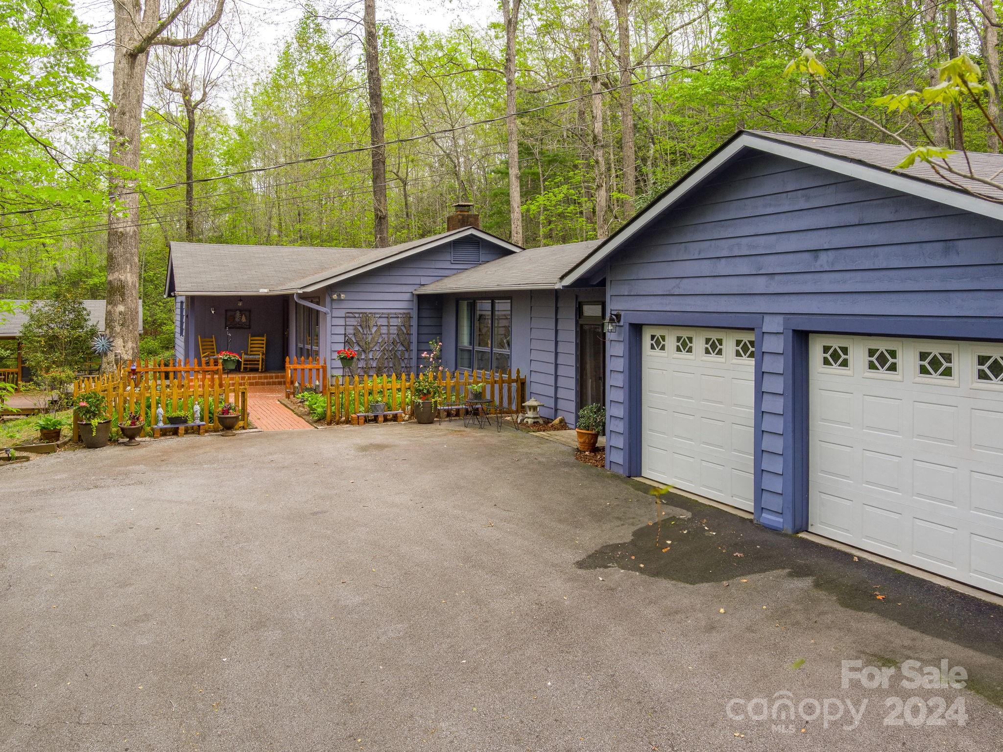 159 Jervey Road Tryon, NC 28782 - Photo 33 of 43 a view of a house with a yard and large tree