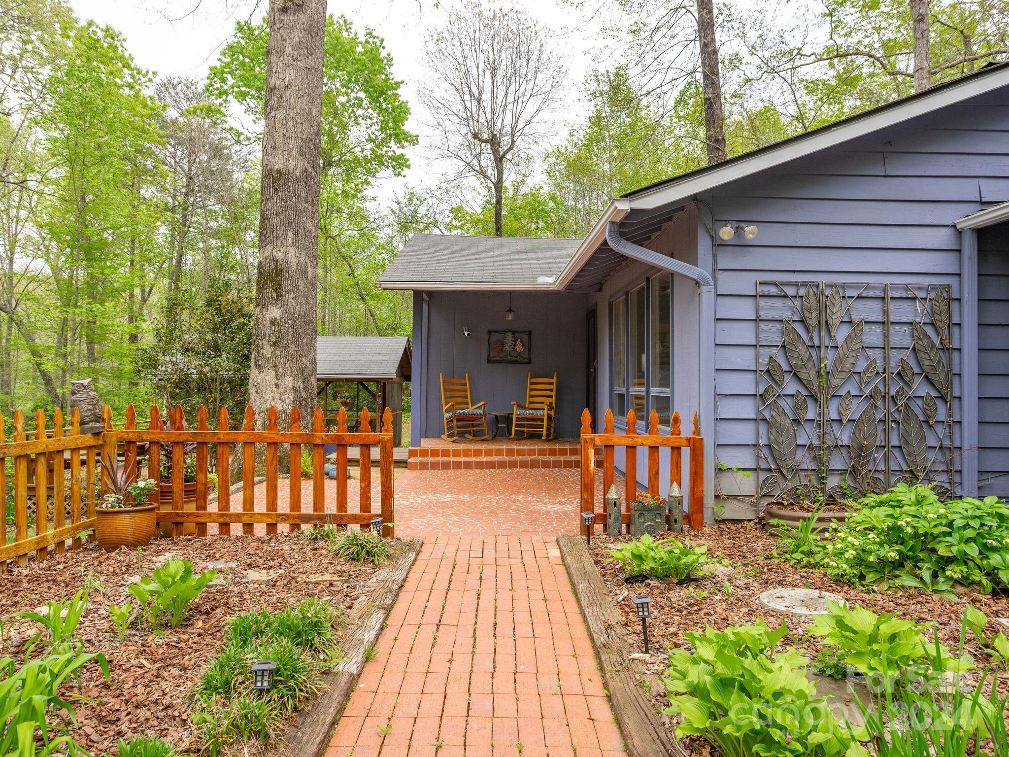 159 Jervey Road Tryon, NC 28782 - Photo 34 of 43 a front view of a house with a patio