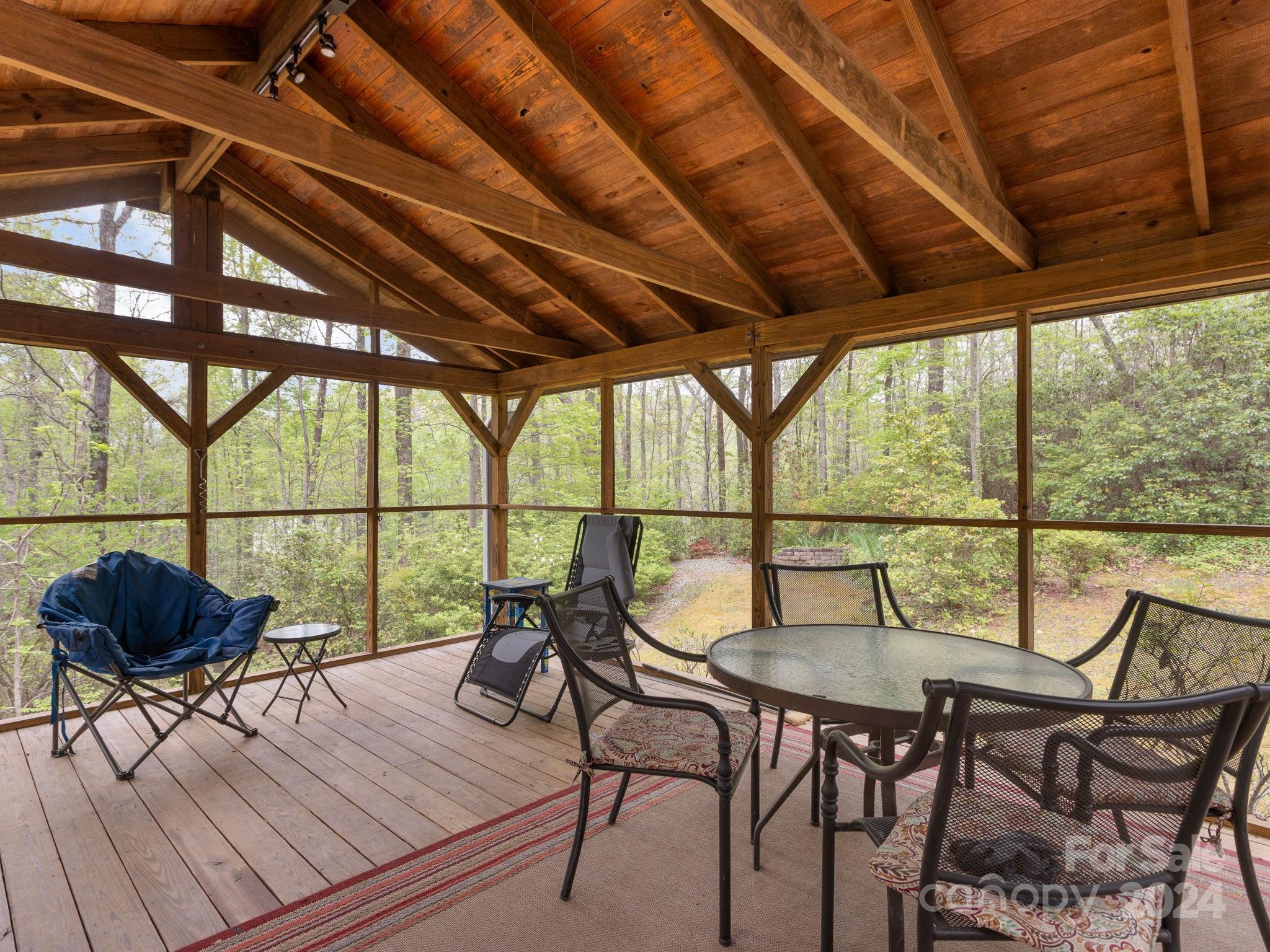 159 Jervey Road Tryon, NC 28782 - Photo 37 of 43 a balcony with wooden floor and outdoor seating