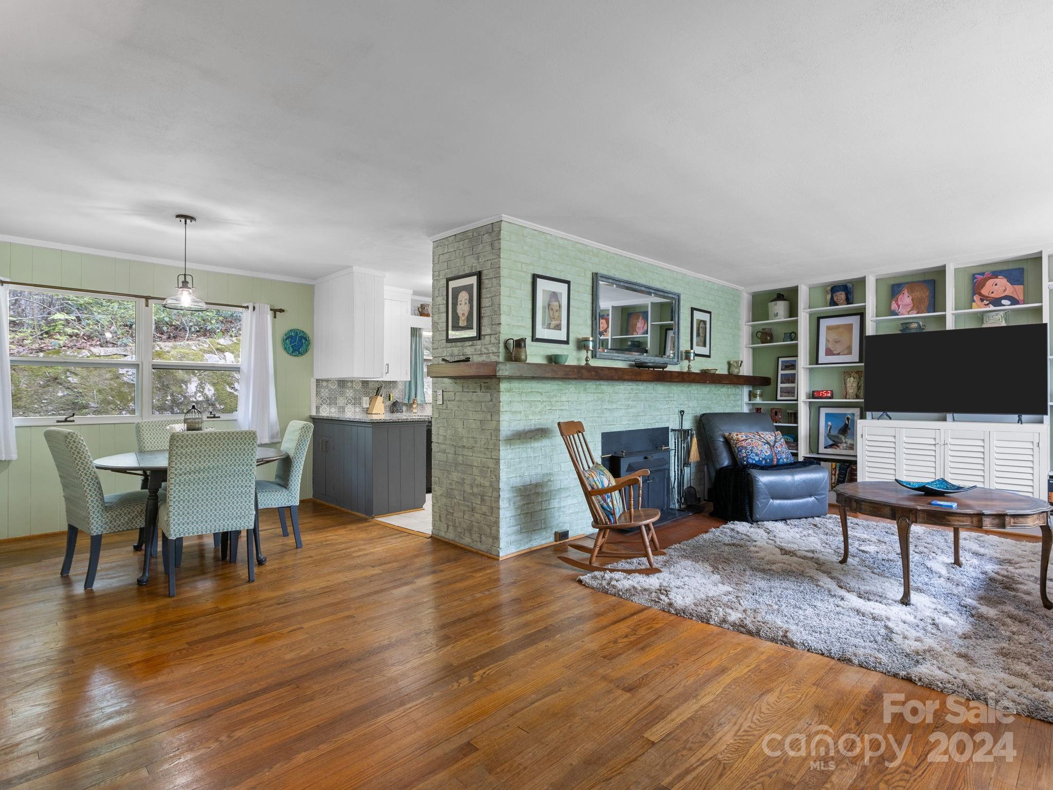 159 Jervey Road Tryon, NC 28782 - Photo 4 of 43 a view of a dining room with furniture window and wooden floor