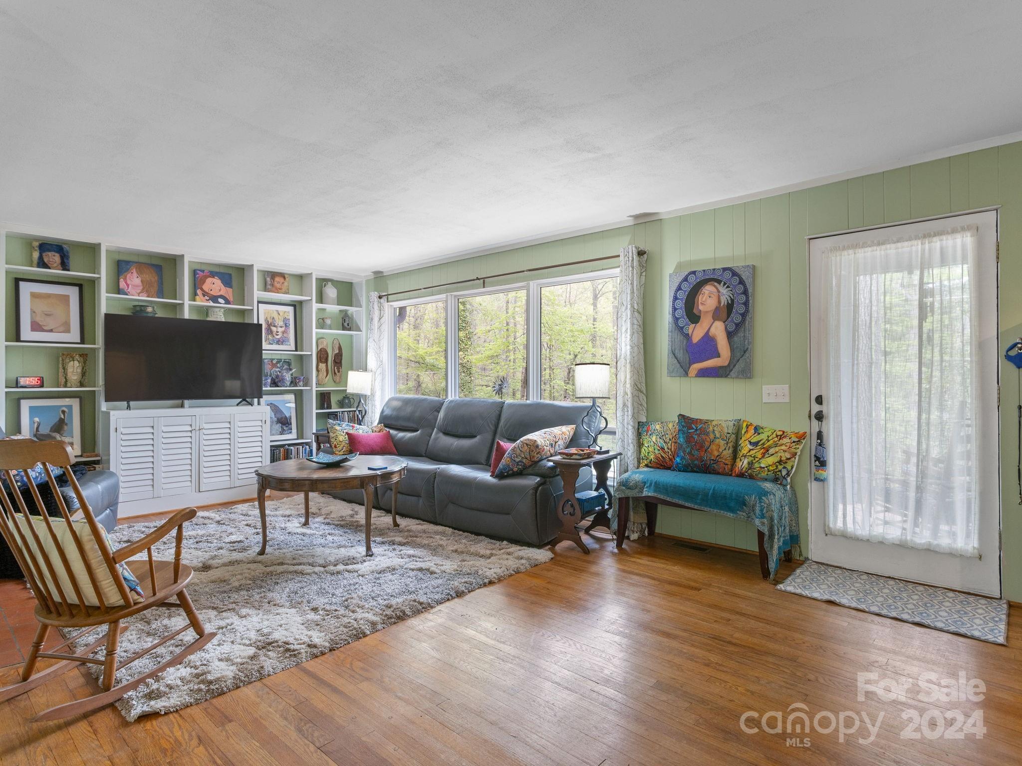 159 Jervey Road Tryon, NC 28782 - Photo 6 of 43 a living room with furniture a flat screen tv and a window