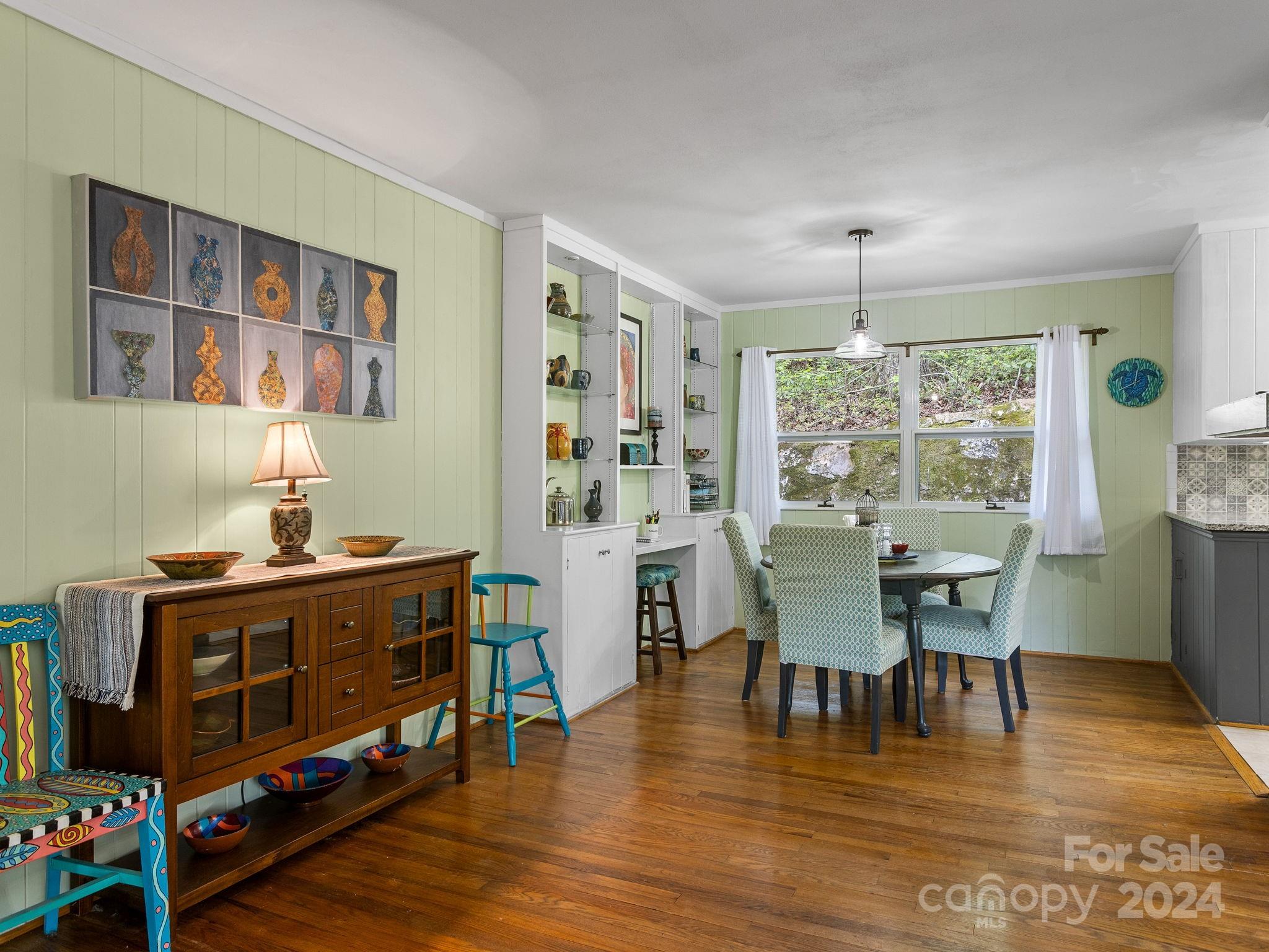 159 Jervey Road Tryon, NC 28782 - Photo 8 of 43 a view of a dining room with furniture window and wooden floor