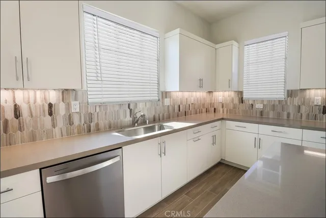a kitchen with a sink and cabinets