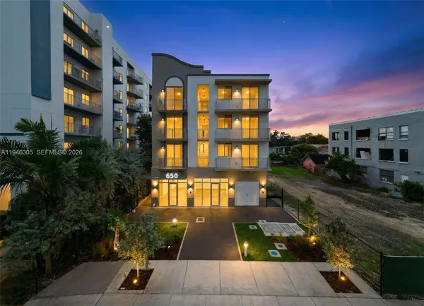 a view of multiple houses with a yard
