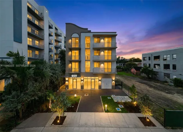 a view of multiple houses with a yard