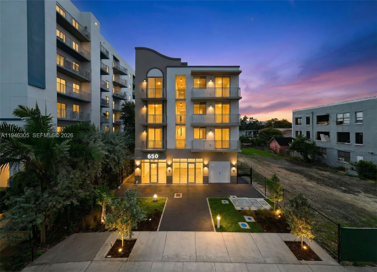 a view of multiple houses with a yard
