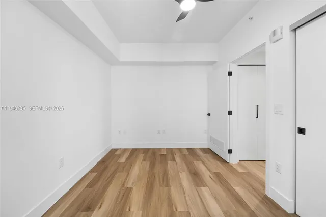 a view of a room with wooden floor and small staircase