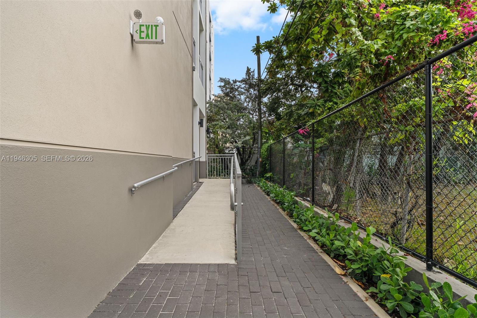 650 Southwest 1st Street, Unit 406 Miami, FL 33130 - Photo 27 of 33 a path view of a pathway both side of house