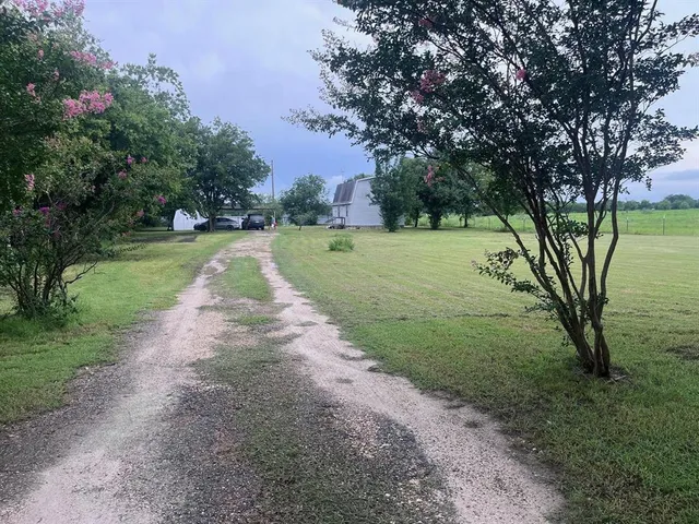 a view of backyard with green space