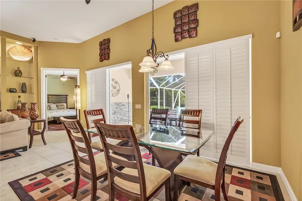 a table with chairs in front of a door