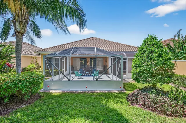a building outdoor space with patio furniture and a potted plant