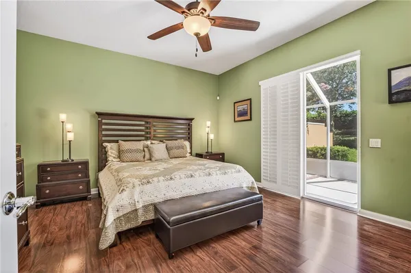a bedroom with a bed dresser and a window