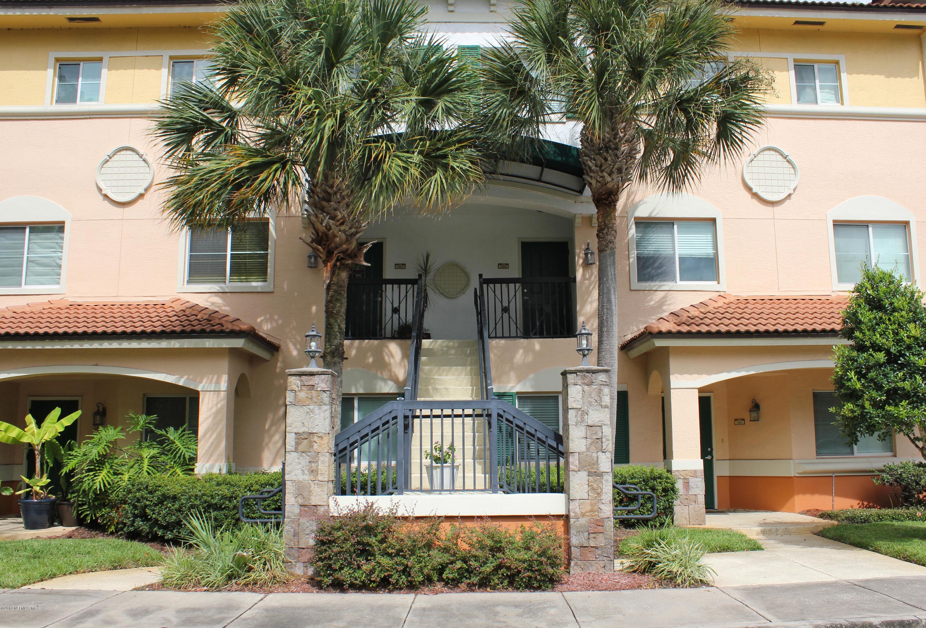 9745 Touchton Road, Unit 1323 Jacksonville, FL 32246 - Photo 2 of 19 a front view of a house with garden and plants