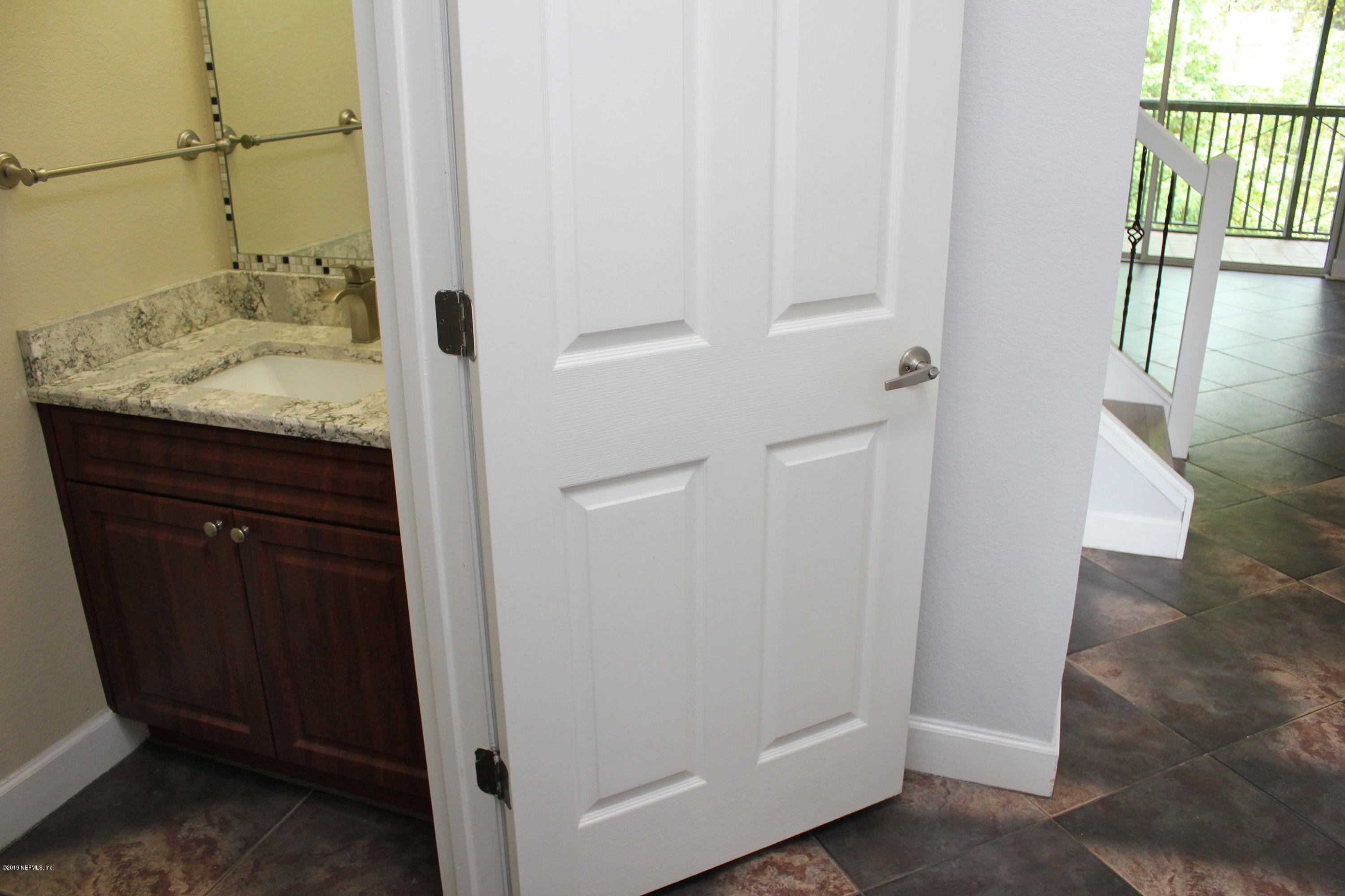9745 Touchton Road, Unit 1323 Jacksonville, FL 32246 - Photo 9 of 19 a bathroom with a sink and vanity
