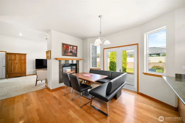 a living room with furniture a window and a chandelier