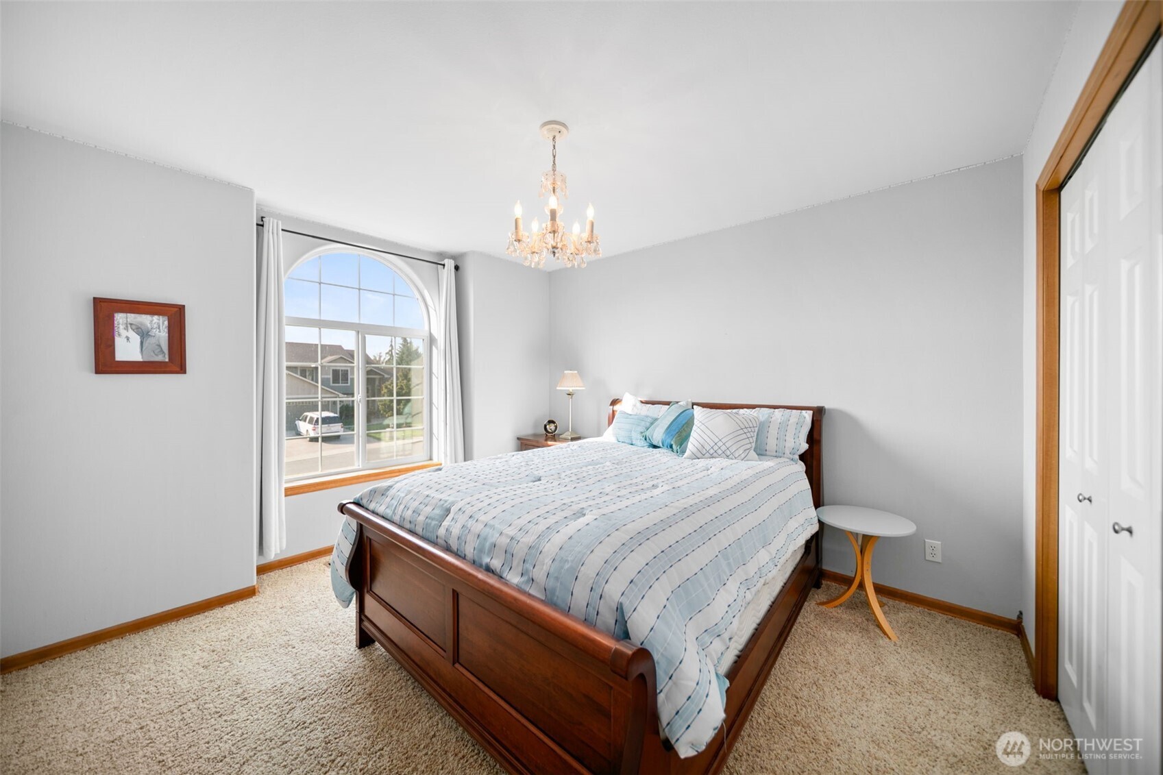 194 Lilly Lane Wenatchee, WA 98801 - Photo 21 of 37 a bed sitting in a bedroom next to a window