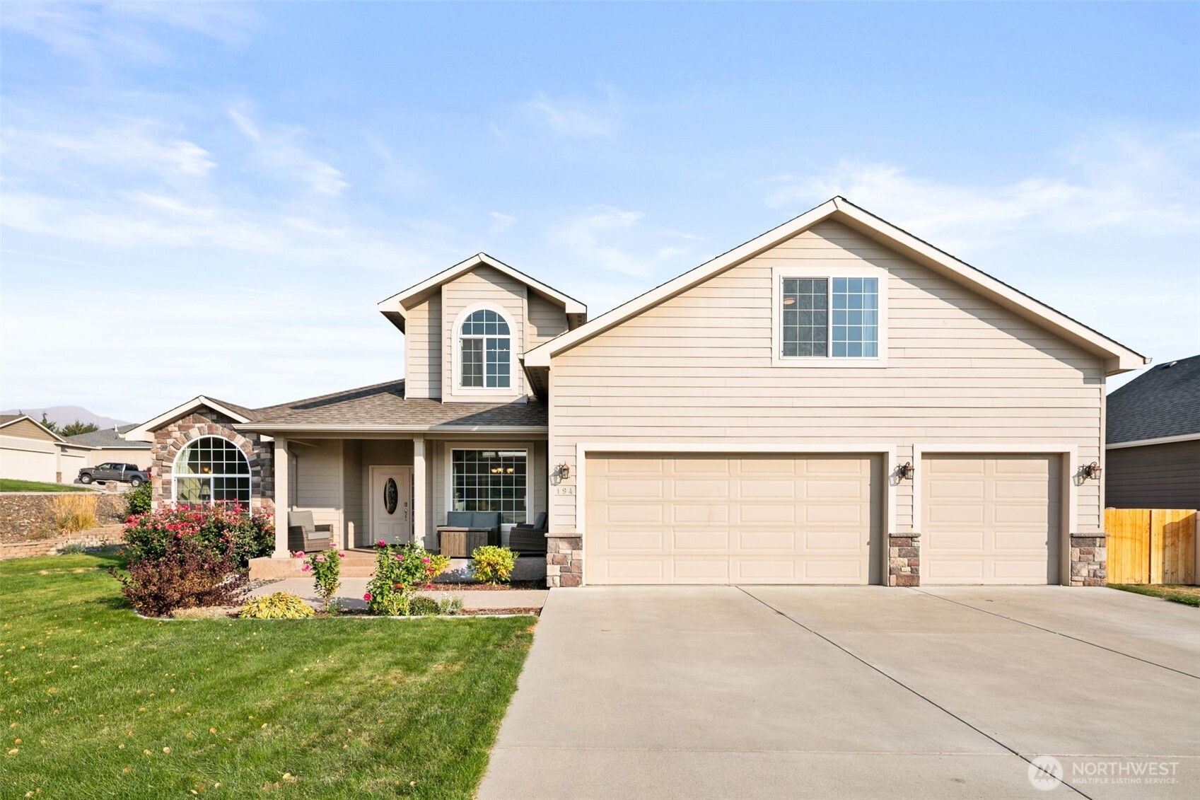 194 Lilly Lane Wenatchee, WA 98801 - Photo 28 of 37 a front view of a house with a garden and porch