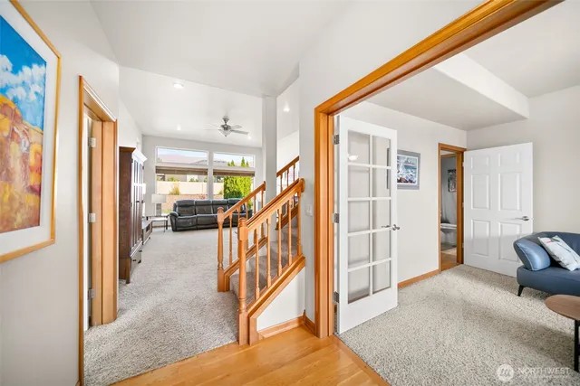 a view of a livingroom with furniture and stairs