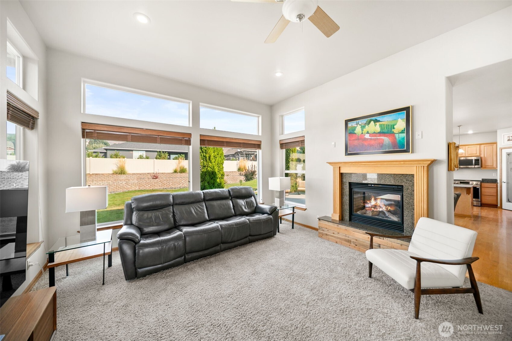 194 Lilly Lane Wenatchee, WA 98801 - Photo 8 of 37 a living room with furniture a large window and a fireplace