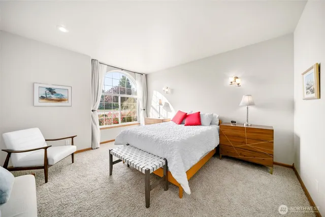 a bedroom with a bed and a table