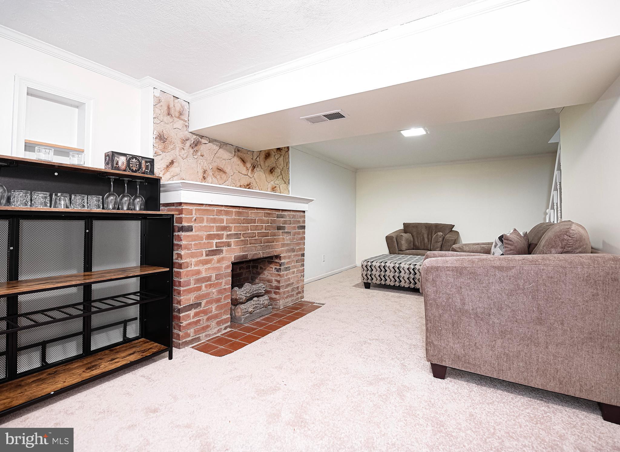 323 Walgrove Road Reisterstown, MD 21136 - Photo 19 of 26 Finished lower level with fireplace.