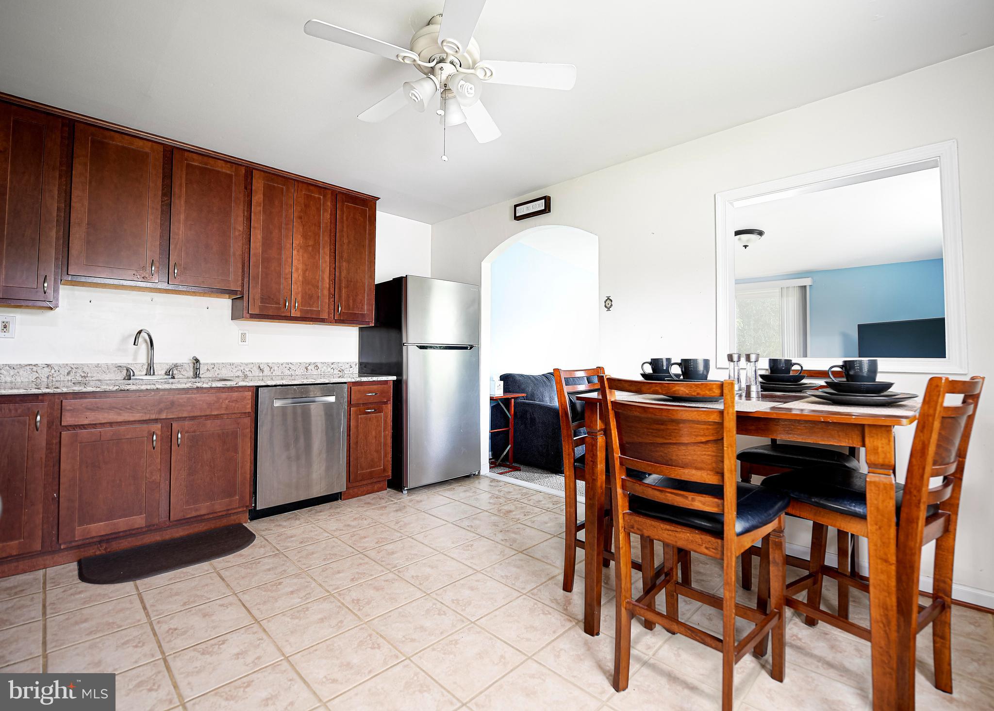 323 Walgrove Road Reisterstown, MD 21136 - Photo 9 of 26 Ceiling fan & pass thru to sunroom