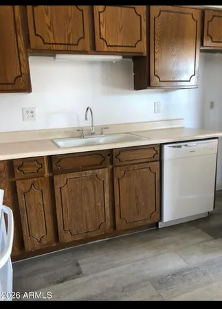 a kitchen with a sink and cabinets