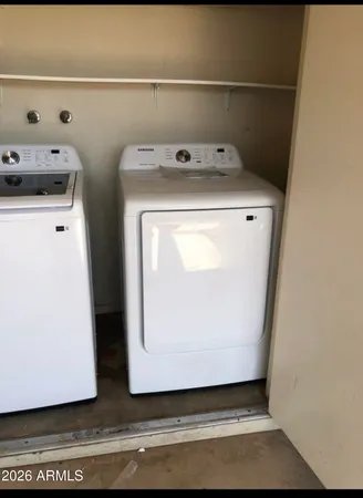 a utility room with dryer and washer