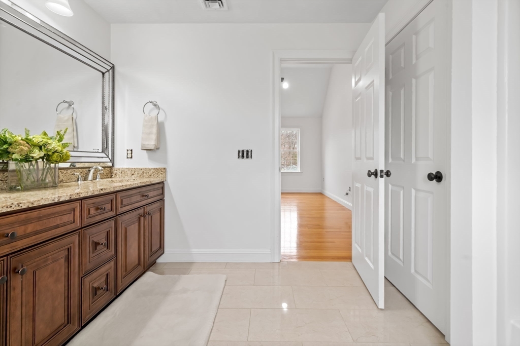 30 Neponset Street Walpole, MA 02071 - Photo 27 of 41 a bathroom with a double vanity sink and a mirror
