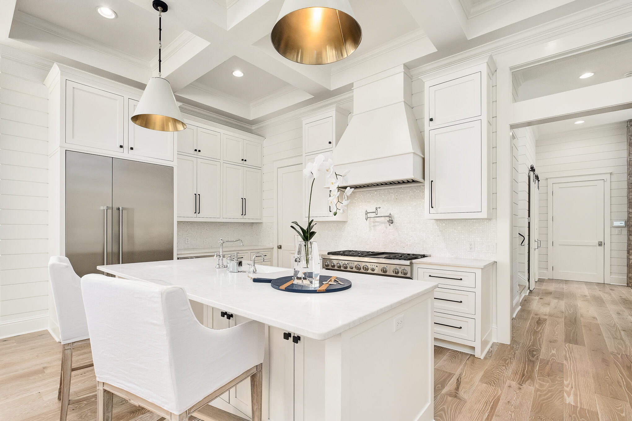 29 Bennett Santa Rosa Beach, FL 32459 - Photo 16 of 78 a kitchen with stainless steel appliances kitchen island granite countertop a sink a stove a refrigerator and white cabinets with wooden floor
