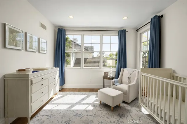 a living room with furniture and windows