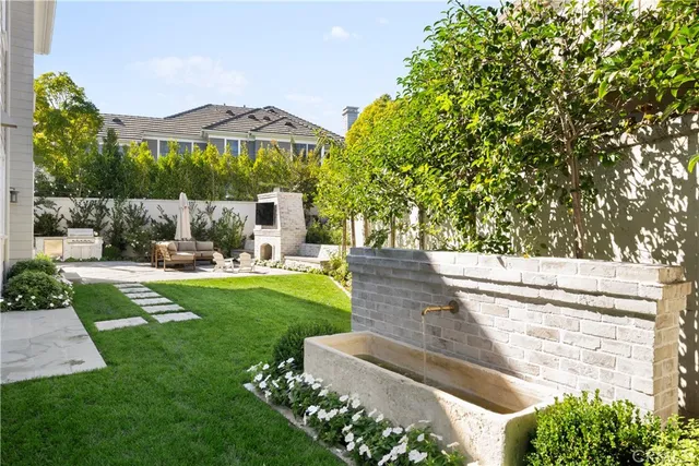 a view of a house with garden and a garden