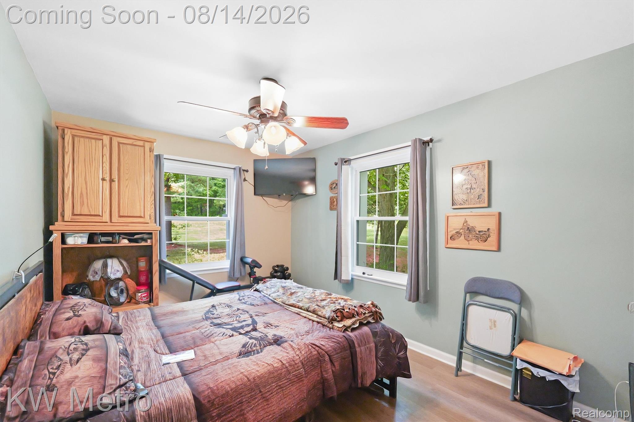 201 South Maple Leaf Road Lapeer, MI 48446 - Photo 14 of 70 Wood-finish flooring, light-colored wall paint, and a ceiling fan with integrated lighting