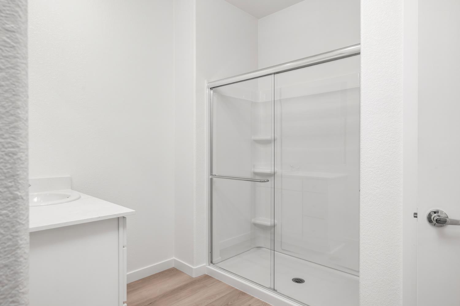 2199 Nicklaus Drive Linda, CA 95901 - Photo 13 of 16 a bathroom with a glass shower door