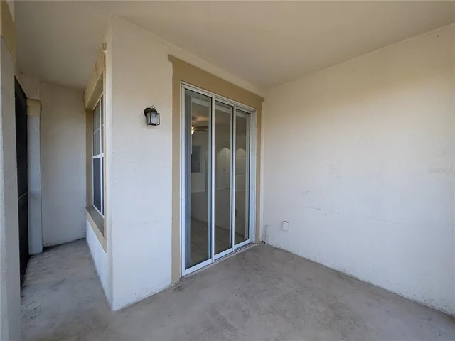 a view of an empty room and closet area