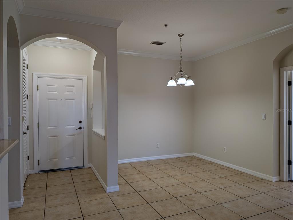 8156 Boat Hook Loop, Unit 303 Windermere, FL 34786 - Photo 5 of 26 an empty room with chandelier fan