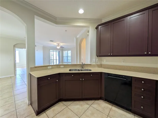a kitchen with a sink and cabinets