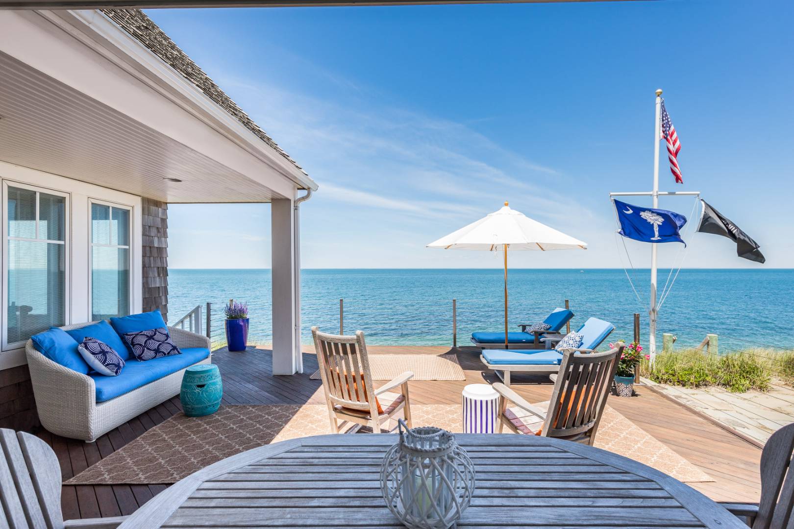 32 Captain Kidds Path Montauk, NY 11954 - Photo 1 of 25 a outdoor space with patio the couches and dining table with chairs