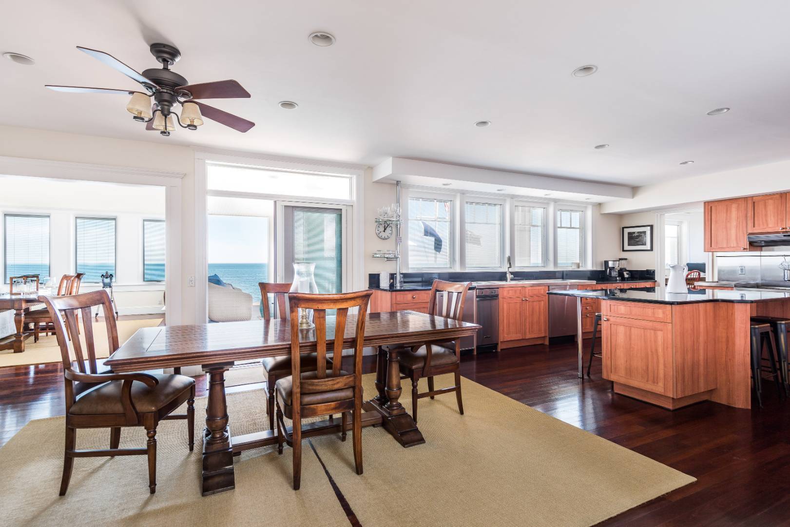 32 Captain Kidds Path Montauk, NY 11954 - Photo 11 of 25 a view of a dining room with furniture window and wooden floor