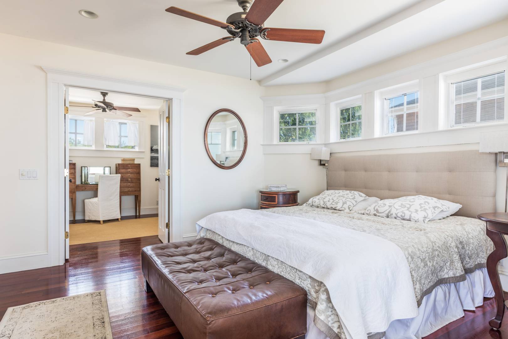 32 Captain Kidds Path Montauk, NY 11954 - Photo 13 of 25 a bedroom with a bed and a chandelier