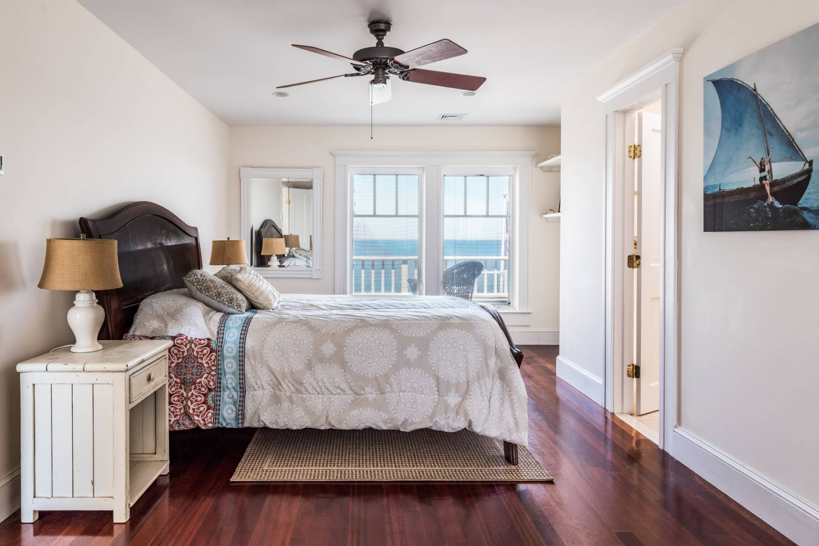 32 Captain Kidds Path Montauk, NY 11954 - Photo 15 of 25 a bedroom with a bed and wooden floor