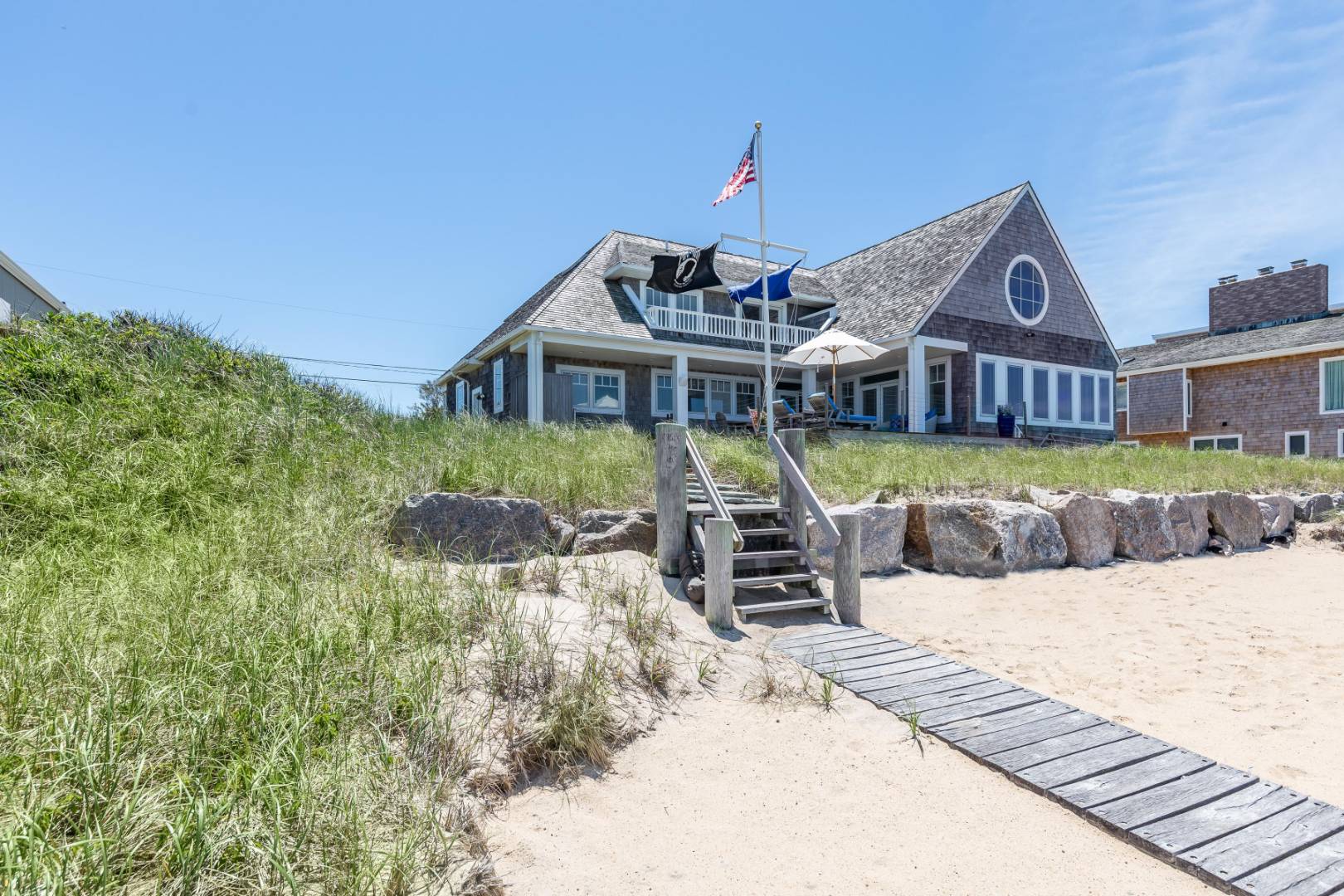 32 Captain Kidds Path Montauk, NY 11954 - Photo 3 of 25 a view of a house with a yard and sitting area