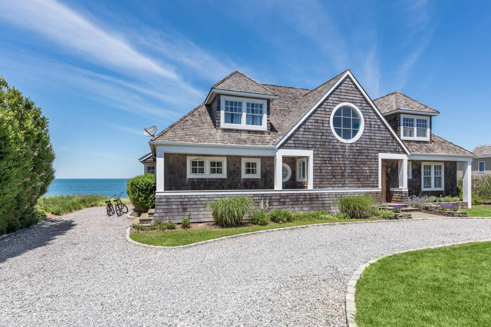 32 Captain Kidds Path Montauk, NY 11954 - Photo 24 of 25 a front view of a house with a yard