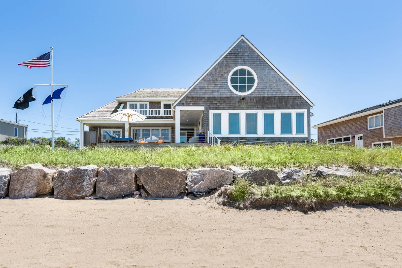 32 Captain Kidds Path Montauk, NY 11954 - Photo 4 of 25 a front view of a house with a yard