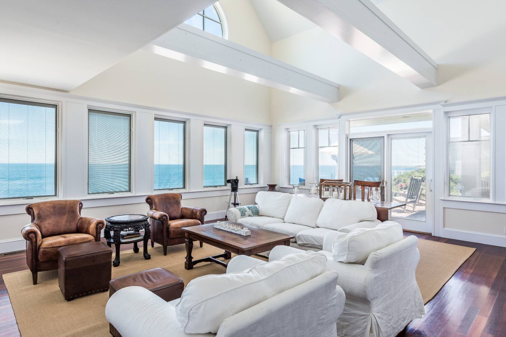 32 Captain Kidds Path Montauk, NY 11954 - Photo 5 of 25 a living room with furniture and a large window